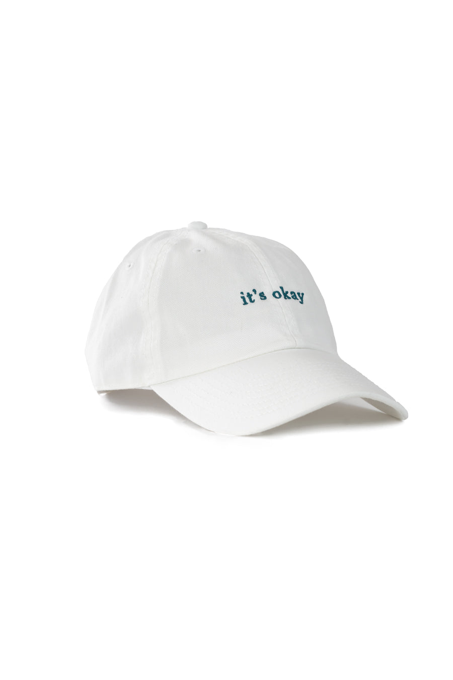 it's okay organic cap white| made with organic cotton, embroidered. This is a studio photography of the cap.