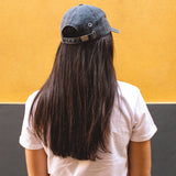 Blueberry cap, 100% cotton, vintage look, embroidered. it's okay to be exactly who you are. From Portugal with love. (Photography: women with long dark hair wearing blueberry cap).  Boné de pala azul de algodão bordado em Portugal.