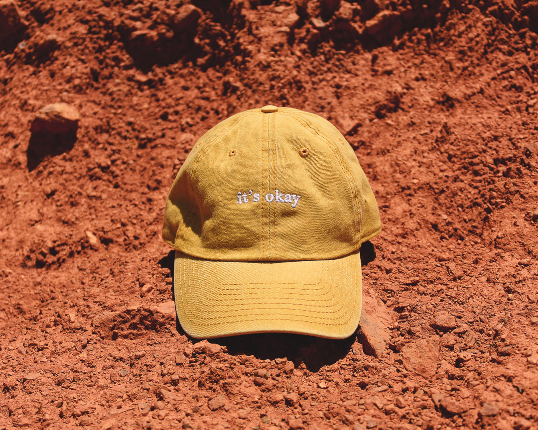 Sunflower cap, yellow cap made with 100% cotton, embroidered. it's okay to be exactly who you are. From Portugal with love. Boné de pala amarelo de algodão bordado em Portugal. Image: Sunflower cap on read sun in the sun.